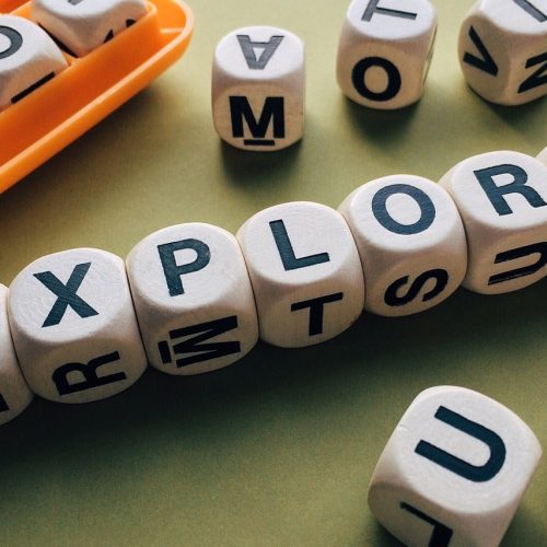 explore spelt out in letter dice