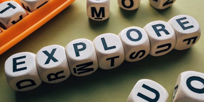 explore spelt out in letter dice