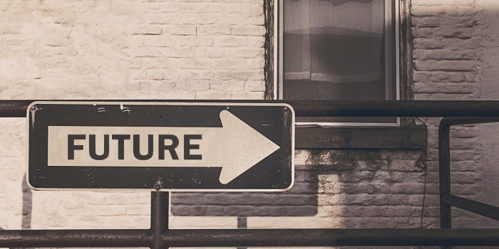 Road sign with arrow with future written on it